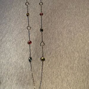 Long silver necklace with stones